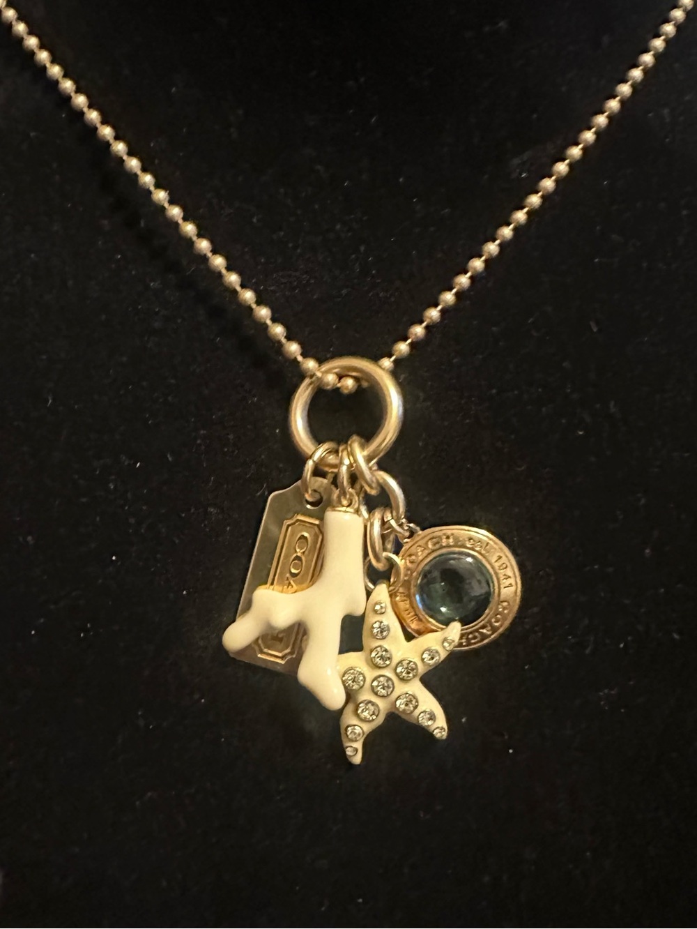 Coach White Coral & Crystal Starfish Charm Necklace with Gold Accents